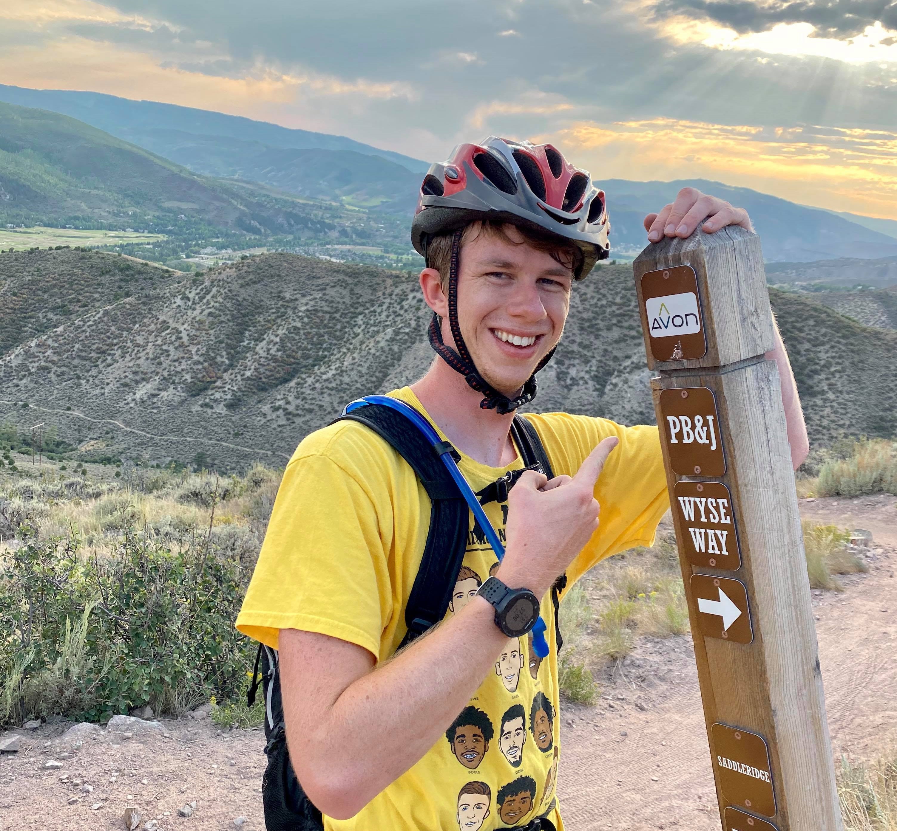 Brian pointing at sign in Colorado